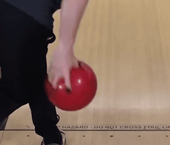 Bowler’s hand position behind the bowling ball at release to create more hand